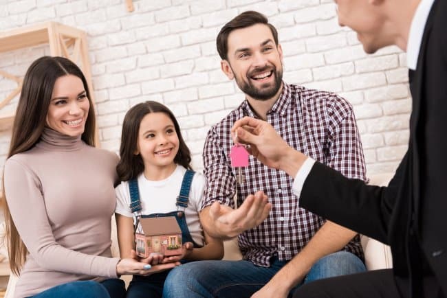 property investment consultant handing over the key to investment property